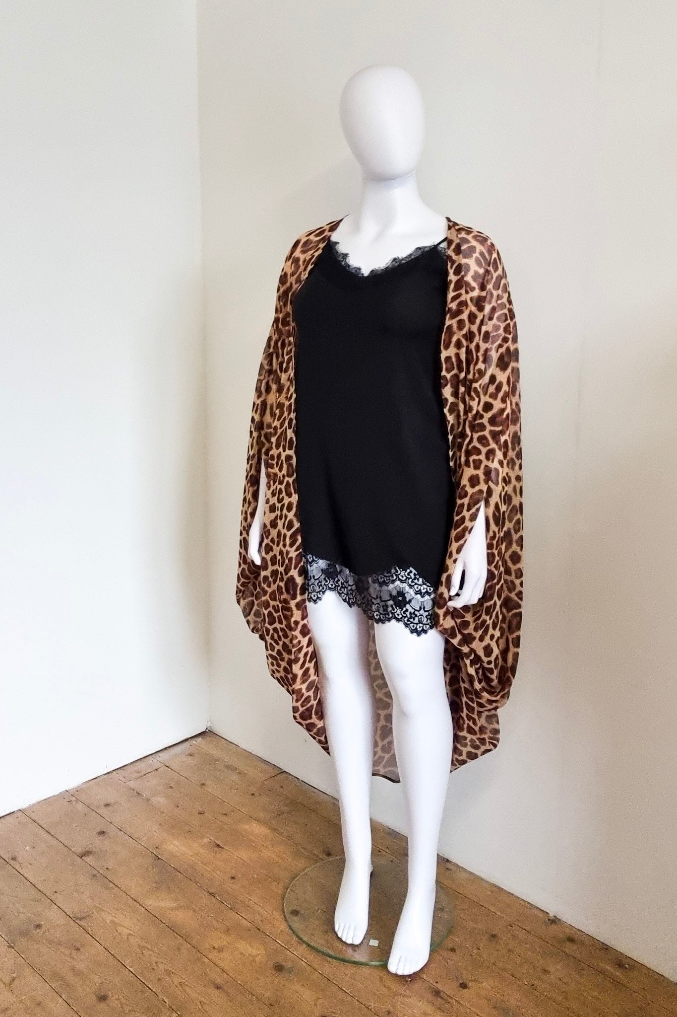 Our mannequin Lavinia is wearing a black lace slip dress, with a Zubi kimono. Front view.
