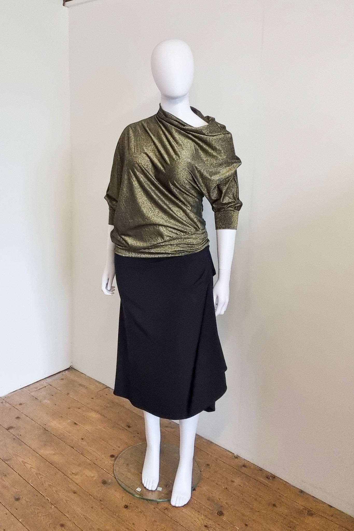 Zadie is photographed on our size 14/16 mannequin, Lavinia. Worn with the black Mitsu skirt, front view.