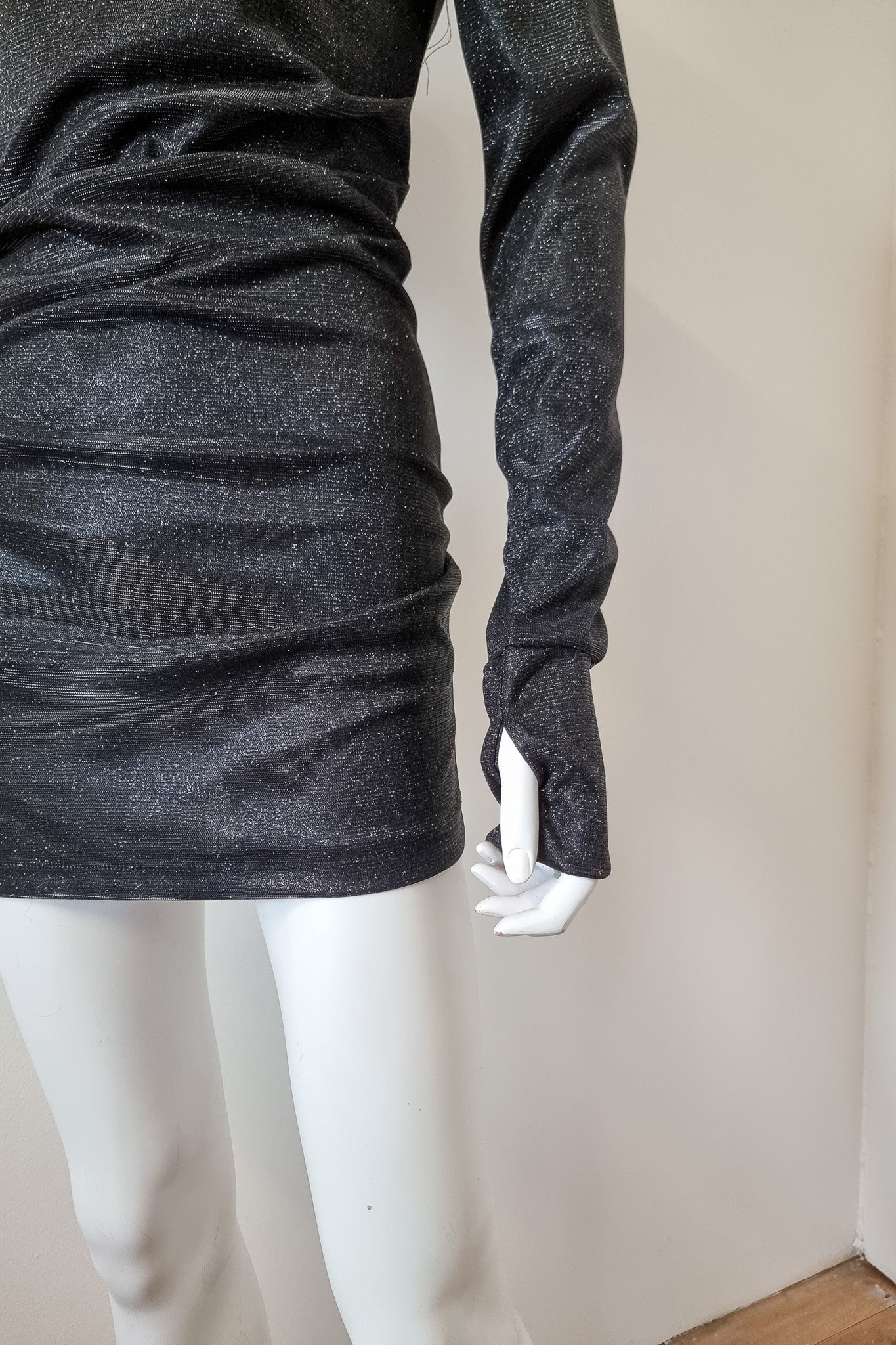 Detailed shot of the arm warmer cuffs on the mannequin