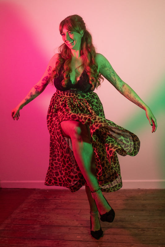 Beautiful shot of our model Amy, dancing in the Fifi skirt. She is wearing Fifi with a lace body and heels.