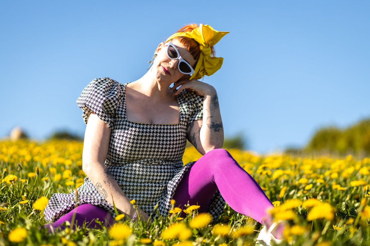 Lindsey sat in a field, in her happy place!