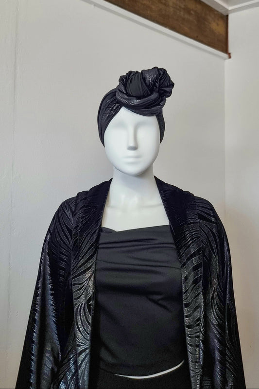 Riri turban knotted in a high twist